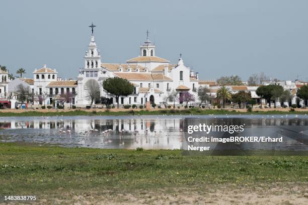 sanctuary ermita de el rocio with lagoon, el rocio, andalusia, spain - provincia de huelva stock pictures, royalty-free photos & images