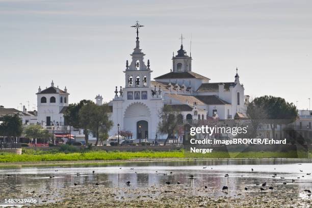 sanctuary ermita de el rocio with lagoon, el rocio, andalusia, spain - provincia de huelva stock pictures, royalty-free photos & images