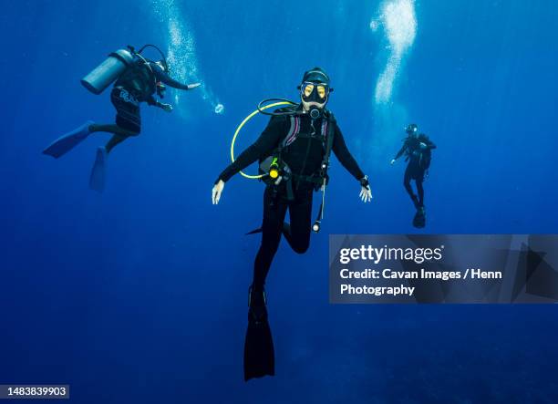 diver floating in the banda sea during mandatory safety stop - aqualung stock pictures, royalty-free photos & images