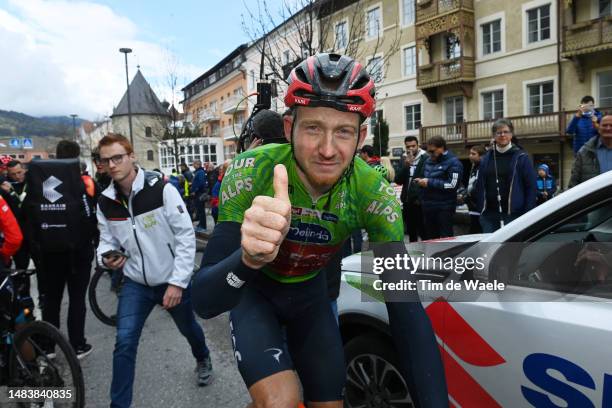 Tao Geoghegan Hart of United Kingdom and Team INEOS Grenadiers - Green Leader Jersey celebrates at finish line as final overall winner after the 46th...