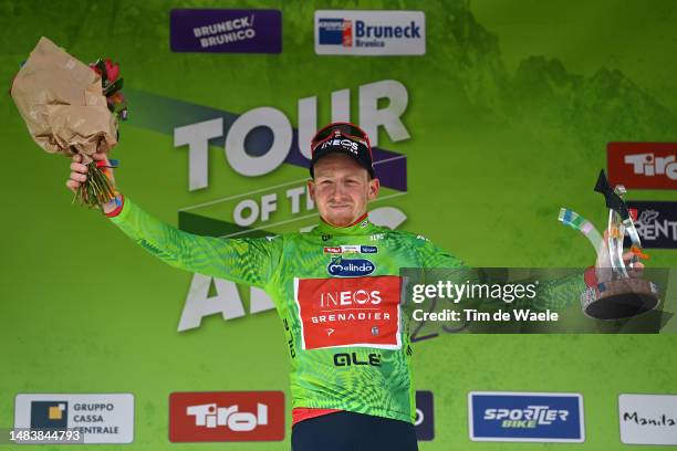 Tao Geoghegan Hart of United Kingdom and Team INEOS Grenadiers - Green Leader Jersey celebrates at podium as final overall winner during the 46th...