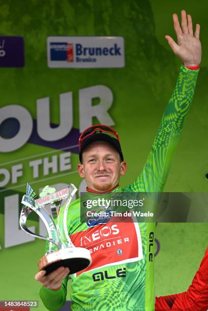 Tao Geoghegan Hart of United Kingdom and Team INEOS Grenadiers - Green Leader Jersey celebrates at podium as final overall winner during the 46th...