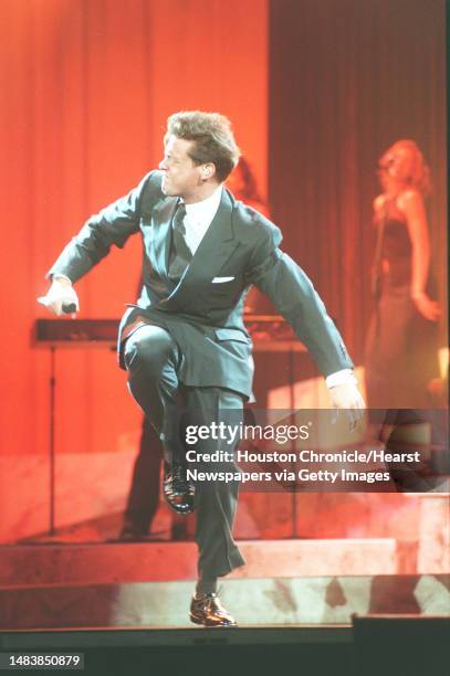 Luis Miguel at the Compaq Center Monday night. HOUCHRON CAPTION : Luis Miguel struts his stuff at a Compaq Center concert Monday night.