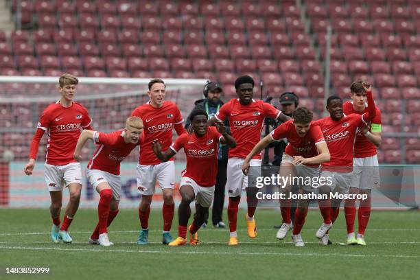 Alkmaar players celebrate as Jayden Addai of AZ Alkmaar scores the winning penalty during the shoot out in the UEFA Youth League 2022/23 Semi-Final...