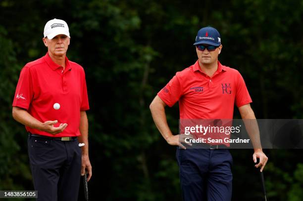 Steve Stricker of the United States and Zach Johnson of the United States wait to putt on the 15th green during the second round of the Zurich...