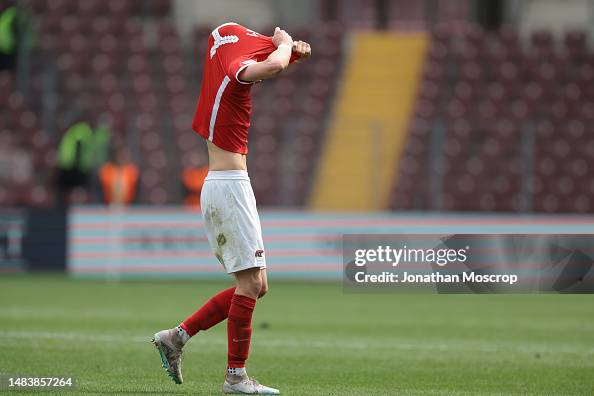 Finn Stam of AZ Alkmaar reacts after being shown a red card by the