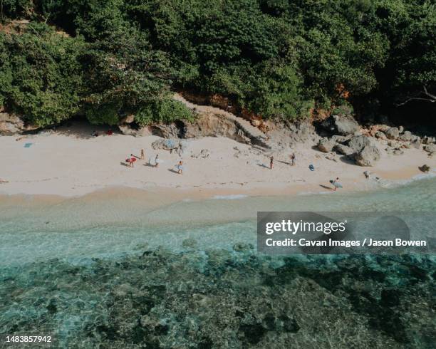 exploring surfing beaches in bali - uluwatu stock pictures, royalty-free photos & images