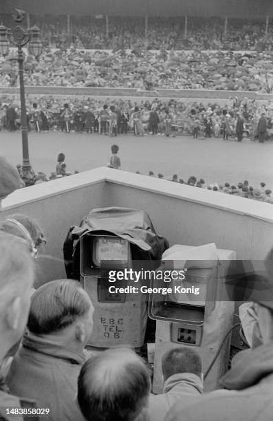 Television crew looks at monitors in a stand overlooking the coronation procession route of Queen Elizabeth II, London, June 2nd 1953. Original...