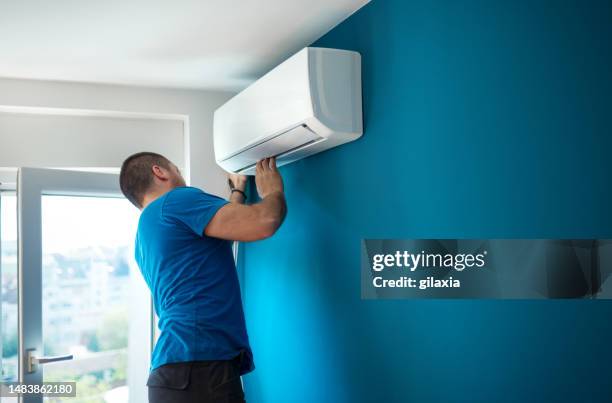 ac unit installment. - installation stock pictures, royalty-free photos & images