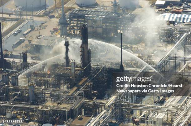 Firefighters battle a blaze and search for victims of an explosion at the BP plant that killed at least 15 people Wednesday, March 23 in Texas City,...