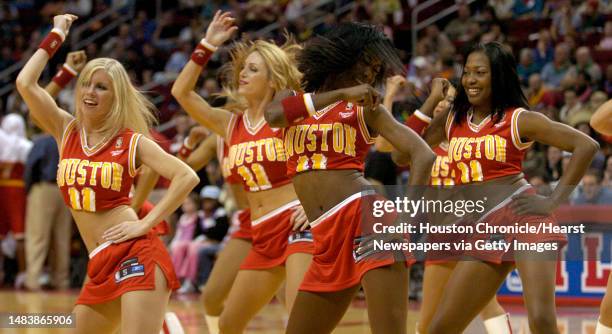 The Rockets Power Dancers, from left, Susie Boudwin, D'Anne Schwebel, Angela Marbley and Aisha Barrie perform a routine during a timeout of the...