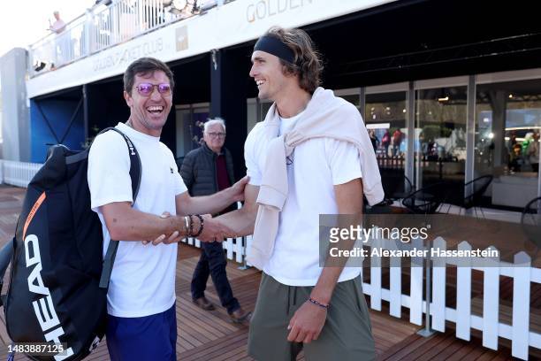 Mischa Zverev smiles with his brother Alexander Zverev during day seven of the BMW Open by American Express at MTTC IPHITOS on April 21, 2023 in...