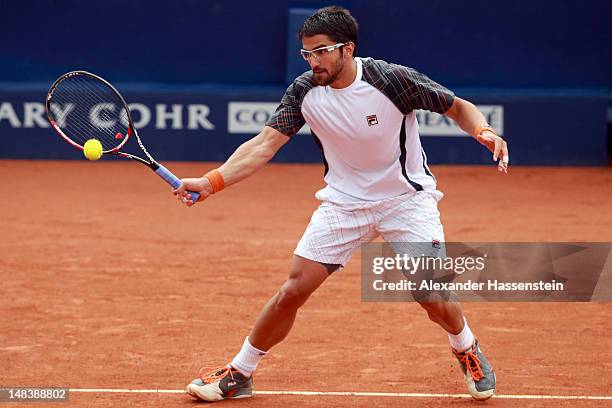 Janko Tipsarevic of Serbia plays a fore hand during his finale match against Juan Monaco of Argentinia during day 6 of Mercedes Cup 2012 at the TC...