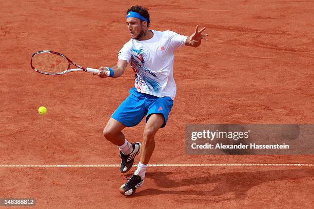 Juan Monaco of Argentinia plays a fore hand during his finale match against Janko Tipsarevic of Serbia during day 6 of Mercedes Cup 2012 at the TC...