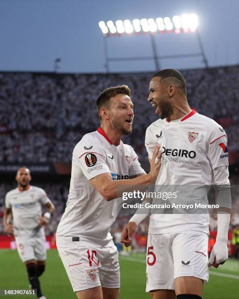 Youssef En-Nesyri of Sevilla FC celebrates scoring their opening goal with teammate Ivan Rakitic during the UEFA Europa League quarterfinal second...