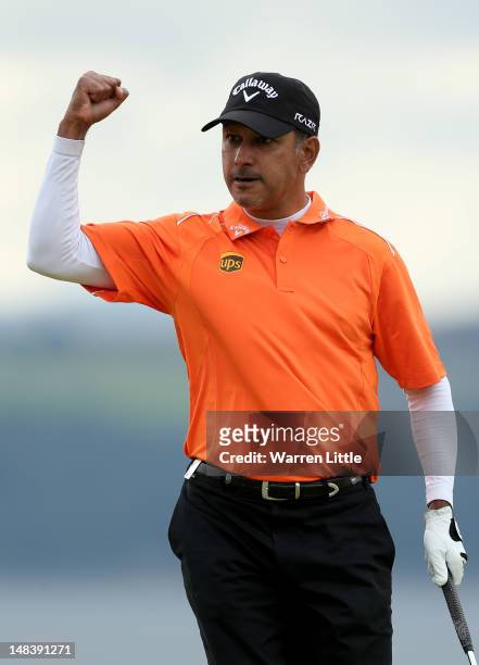 Jeev Milkha Singh of India celebrates holing a putt during a playoff against Francesco Molinari of Italy to win on the 18th green during the final...