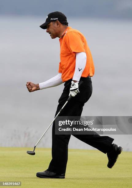 Jeev Milkha Singh of India celebrates holing a putt for victory during a playoff against Francesco Molinari of Italy on the 18th green during the...