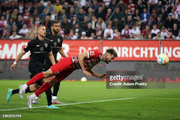 Dion Drena Beljo of Augsburg scores the opening goal during the Bundesliga match between FC Augsburg and VfB Stuttgart at WWK-Arena on April 21, 2023...