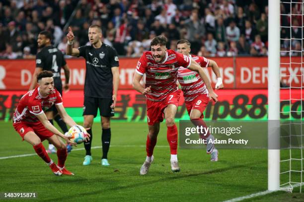 Dion Drena Beljo of Augsburg celebrates scoring the opening goal during the Bundesliga match between FC Augsburg and VfB Stuttgart at WWK-Arena on...