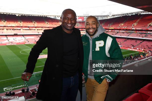Former Arsenal FC players Patrick Vieira and Thierry Henry pose for a photo in the stands prior to the Premier League match between Arsenal FC and...