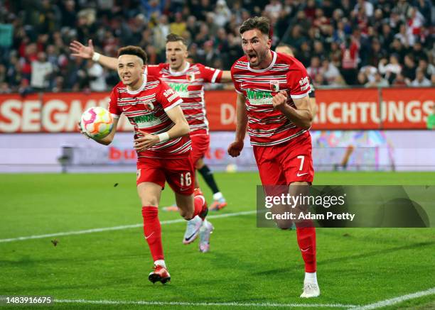 Dion Drena Beljo of Augsburg celebrates scoring the opening goal during the Bundesliga match between FC Augsburg and VfB Stuttgart at WWK-Arena on...