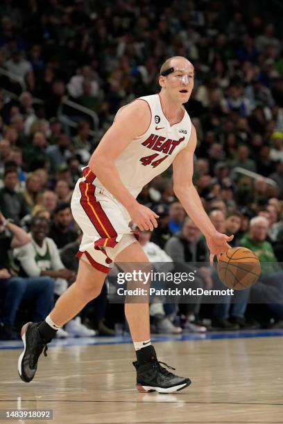 Cody Zeller of the Miami Heat dribbles the ball against the Milwaukee Bucks during the second half of Game Two of the Eastern Conference First Round...