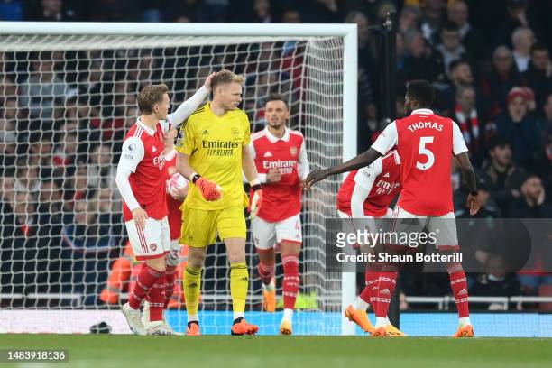 Martin Odegaard of Arsenal interacts with Aaron Ramsdale of Arsenal after conceding their side's first goal scored by Carlos Alcaraz of Southampton...