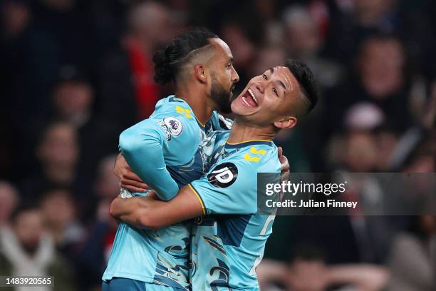 Theo Walcott of Southampton celebrates with teammate Carlos Alcaraz after scoring the team's second goal during the Premier League match between...