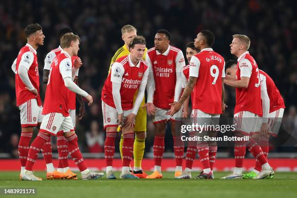 Rob Holding of Arsenal and teammates look dejected after conceding their side's second goal scored by Theo Walcott of Southampton during the Premier...