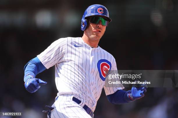 Cody Bellinger of the Chicago Cubs celebrates after hitting a solo home run off Julio Urias of the Los Angeles Dodgers during the third inning at...