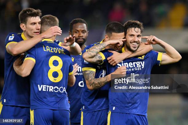 Simone Verdi of Hellas Verona celebrates with teammate Fabio Depaoli after scoring the team's first goal from the penalty spot during the Serie A...