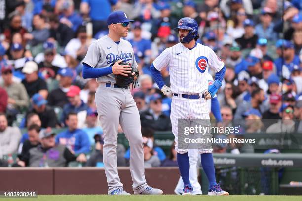 Freddie Freeman of the Los Angeles Dodgers and Dansby Swanson of the Chicago Cubs talk on first base during the fifth inning at Wrigley Field on...