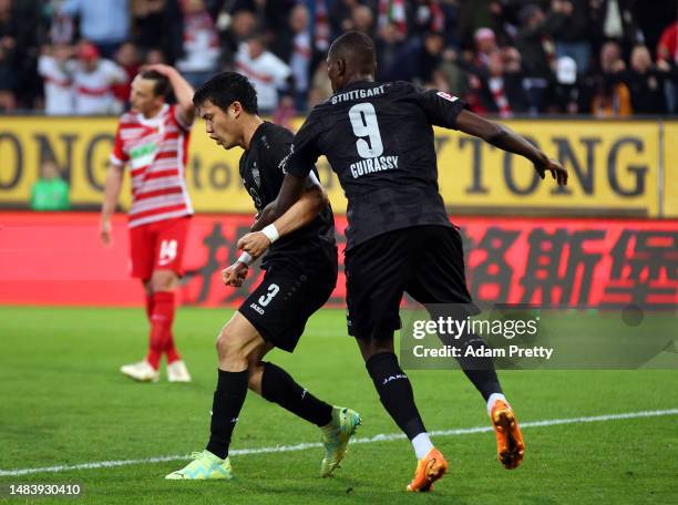 Wataru Endo of VfB Stuttgart reacts to scoring during the Bundesliga match between FC Augsburg and VfB Stuttgart at WWK-Arena on April 21, 2023 in...