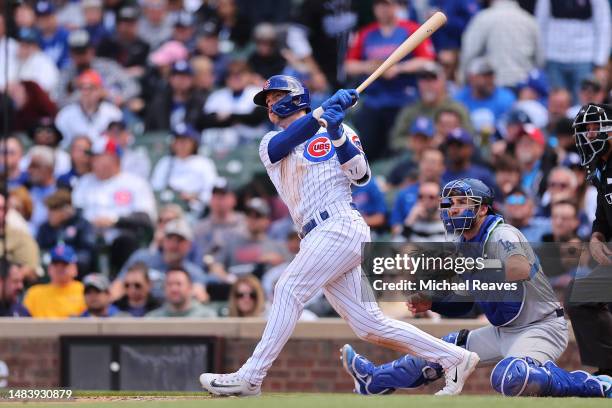 Nico Hoerner of the Chicago Cubs hits a three-run home run against the Los Angeles Dodgers during the fifth inning at Wrigley Field on April 21, 2023...