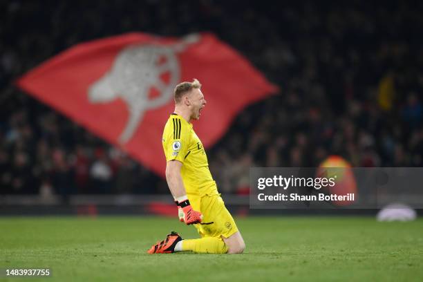 Aaron Ramsdale of Arsenal celebrates after teammate Bukayo Saka of Arsenal scored their side's third goal during the Premier League match between...