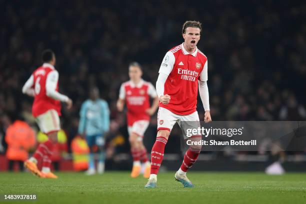 Rob Holding of Arsenal celebrates after teammate Bukayo Saka of Arsenal scored their side's third goal during the Premier League match between...