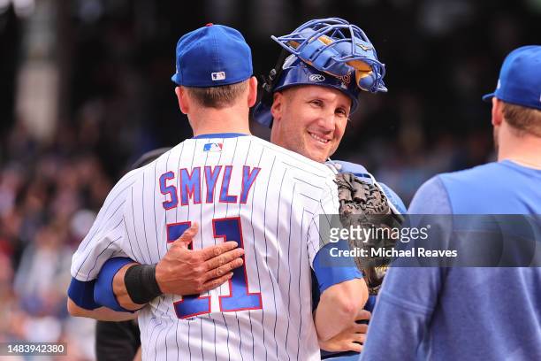 Drew Smyly of the Chicago Cubs hugs Yan Gomes after the game against the Los Angeles Dodgers at Wrigley Field on April 21, 2023 in Chicago, Illinois.