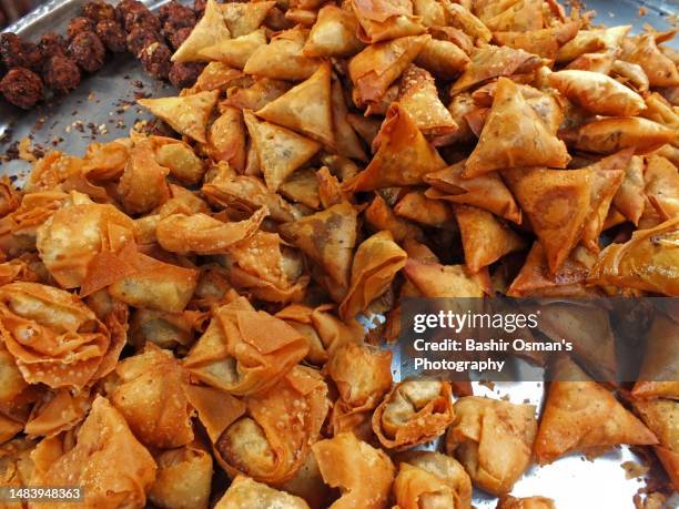 people are busy buying for iftar - samosa stock pictures, royalty-free photos & images