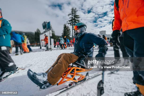 sit-skier enjoying the mountains with friends - disabled extreme sports stock pictures, royalty-free photos & images