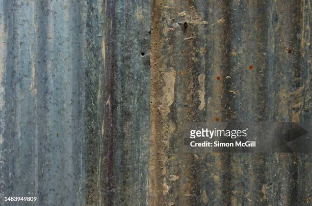 galvanized corrugated iron fence splattered with mud - mud splatter stock pictures, royalty-free photos & images