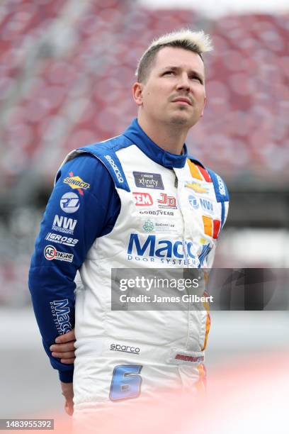 Brennan Poole, driver of the Macc Door Chevrolet, looks on during qualifying for the NASCAR Xfinity Series Ag-Pro 300 at Talladega Superspeedway on...