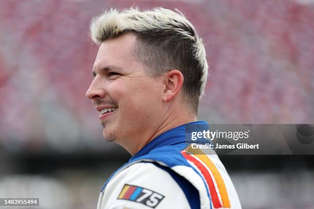 Brennan Poole, driver of the Macc Door Chevrolet, looks on during qualifying for the NASCAR Xfinity Series Ag-Pro 300 at Talladega Superspeedway on...