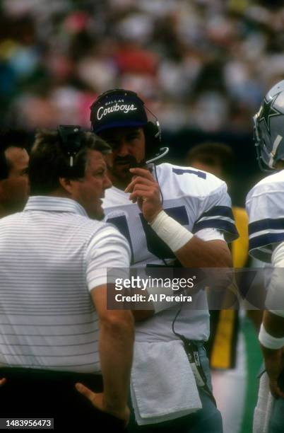 Head Coach Jimmy Johnson of the Dallas Cowboys follows the action with Quarterback Babe Laufenberg in the game between the Dallas Cowboys vs the New...