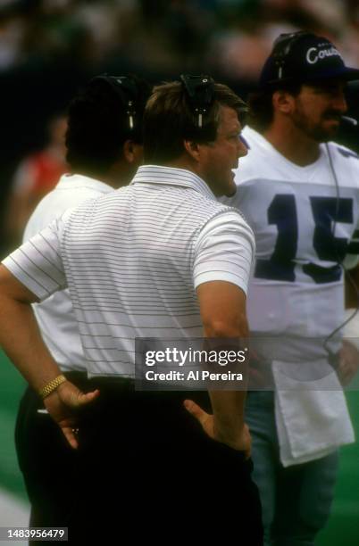 Head Coach Jimmy Johnson of the Dallas Cowboys follows the action with Quarterback Babe Laufenberg in the game between the Dallas Cowboys vs the New...