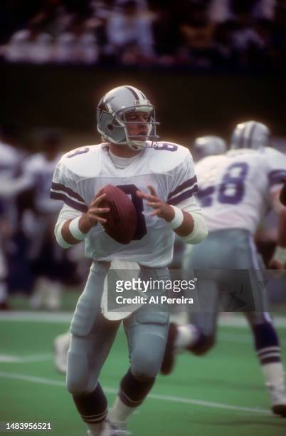 Quarterback Troy Aikman of the Dallas Cowboys drops back to pass the ball in the game between the Dallas Cowboys vs the New York Jets on November 4,...
