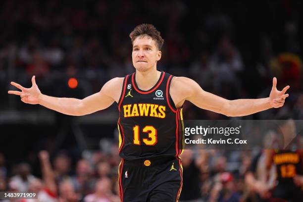 Bogdan Bogdanovic of the Atlanta Hawks reacts after hitting a three-point basket against the Boston Celtics during Game Three of the Eastern...