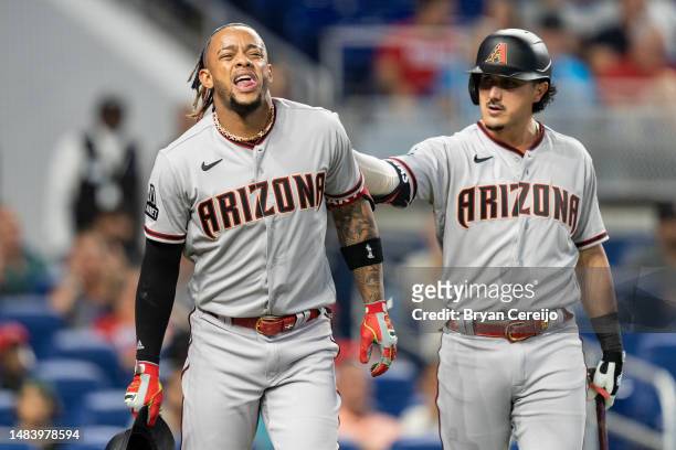 Ketel Marte of the Arizona Diamondbacks reacts after being hit by a News  Photo - Getty Images
