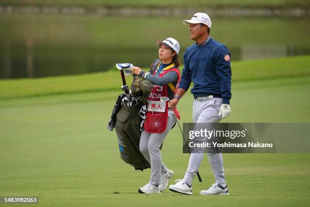 Hideto Tanihara of Japan talks with his caddie on the 3rd hole during day three of the ISPS Handa - Championship at PGM Ishioka GC on April 22, 2023...