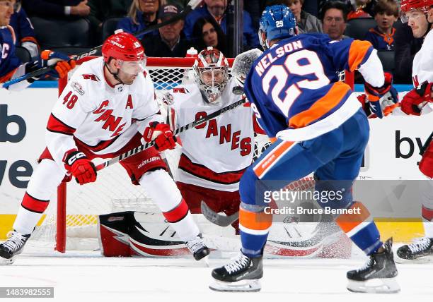 Antti Raanta of the Carolina Hurricanes keeps his eyes on a shot by Brock Nelson of the New York Islanders during the third period in Game Three in...