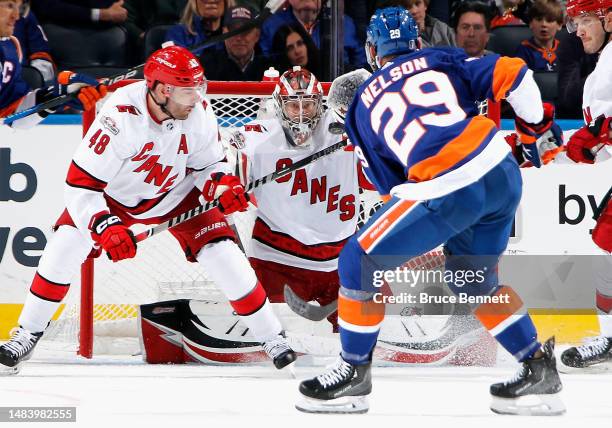 Antti Raanta of the Carolina Hurricanes keeps his eyes on a shot by Brock Nelson of the New York Islanders during the third period in Game Three in...